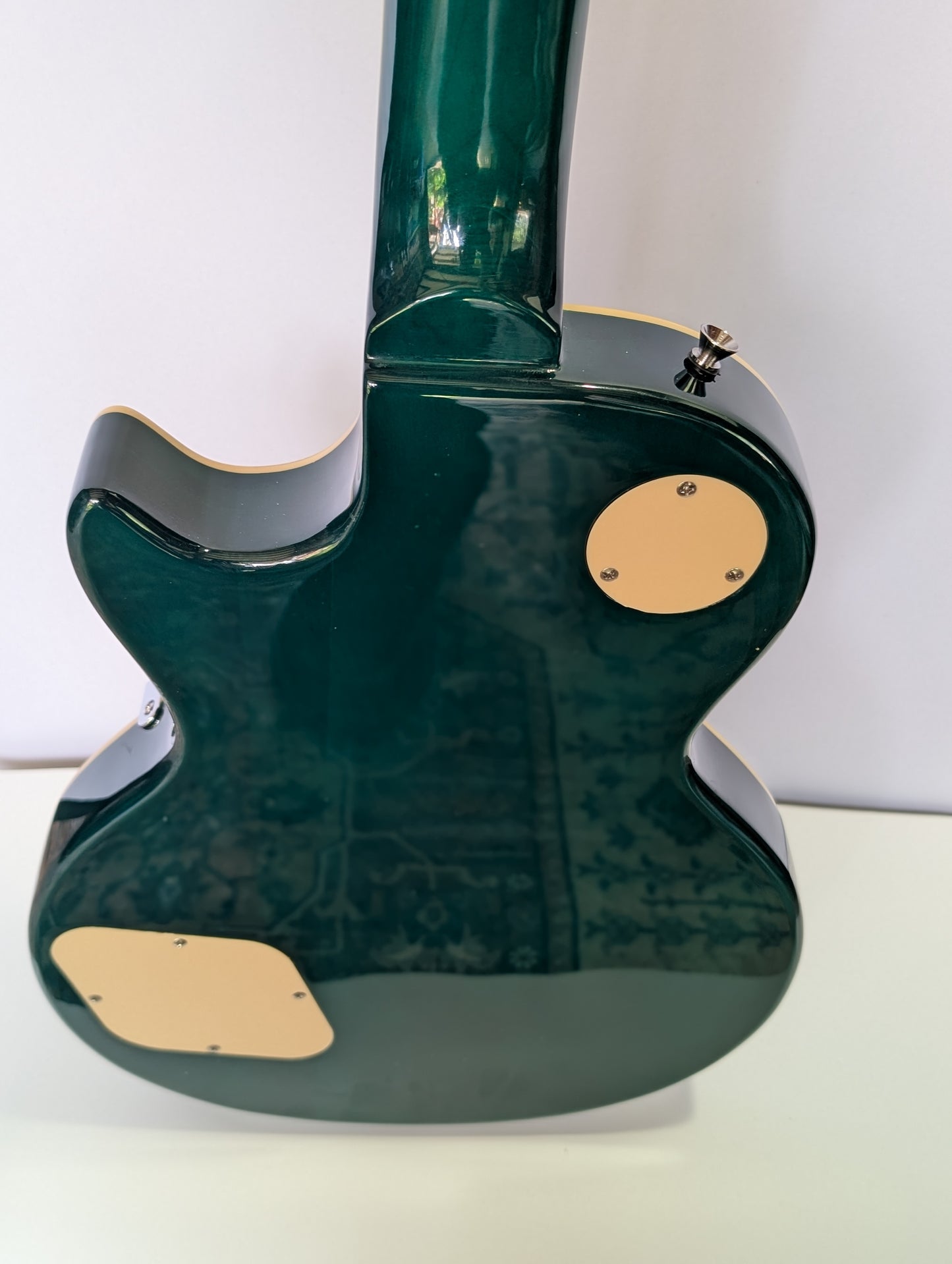 Emerald green Les Paul style electric guitar with stunning flame maple top and premium humbuckers by PNW Music