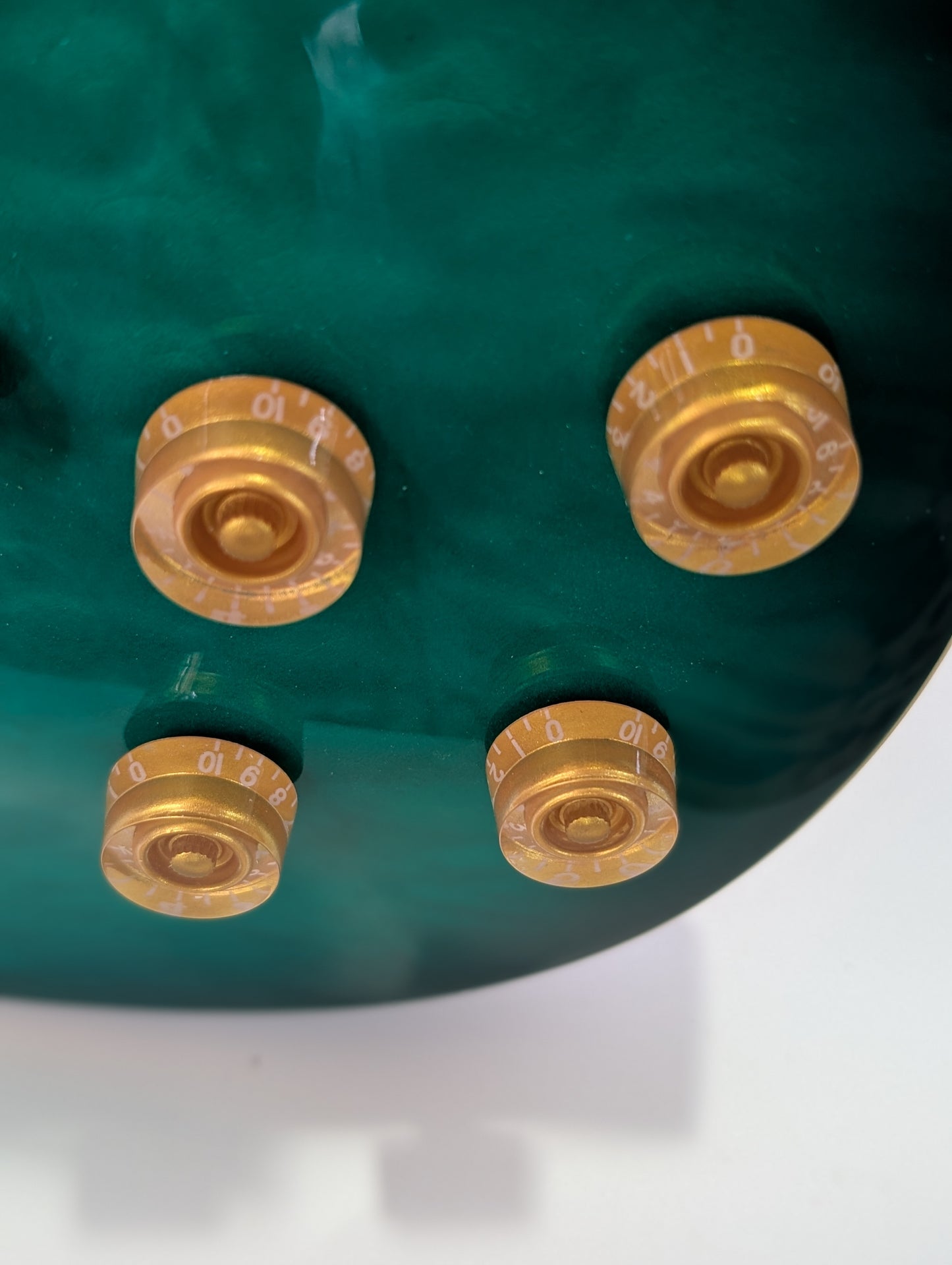 Emerald green Les Paul style electric guitar with stunning flame maple top and premium humbuckers by PNW Music