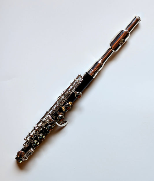 Slade silver-plated headjoint piccolo with black Bakelite body, silver-plated keys and mechanisms for student to intermediate players