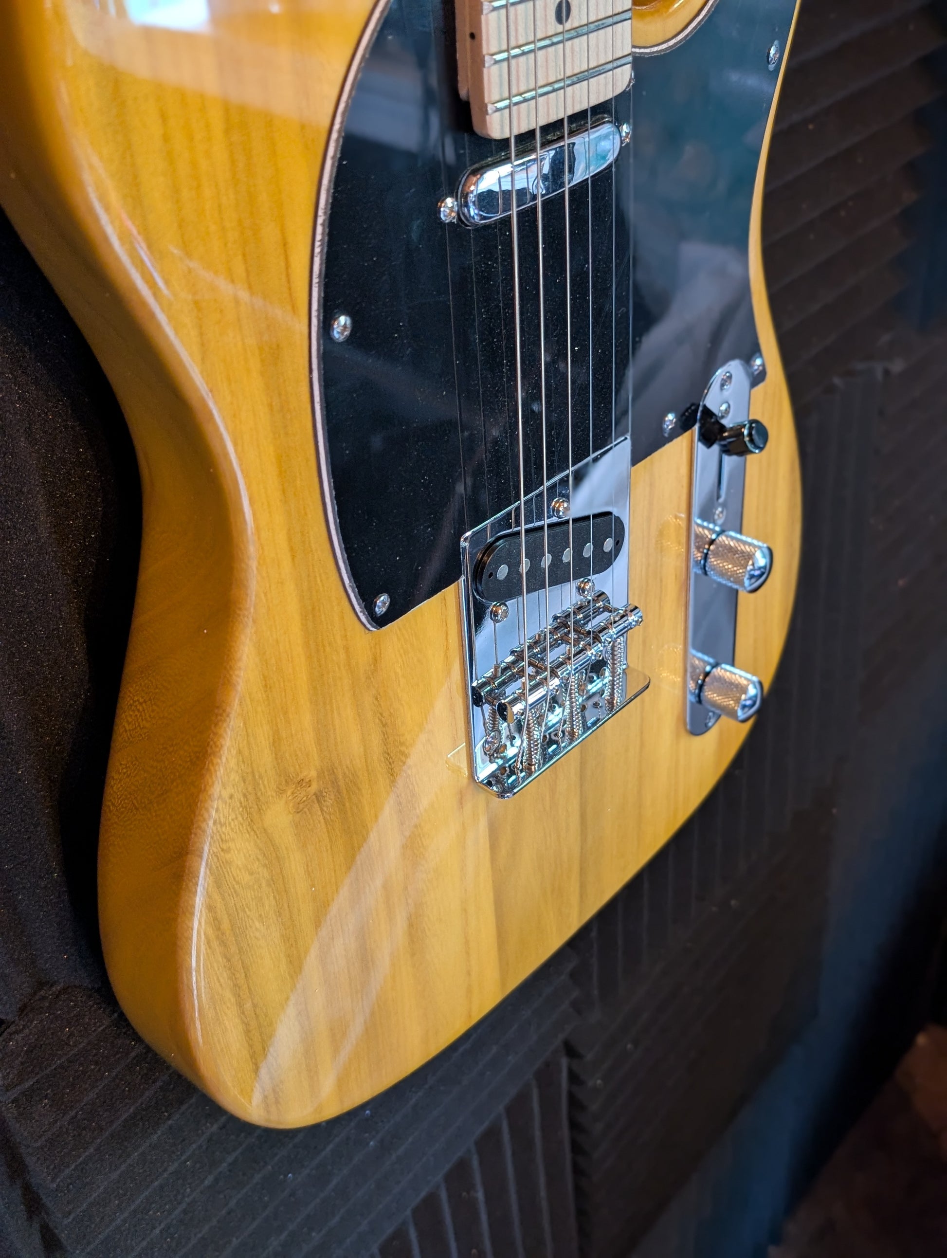 Yellow natural finish Telecaster-style electric guitar with wood grain visible, dual single-coil pickups, Premium setup by PNW Music