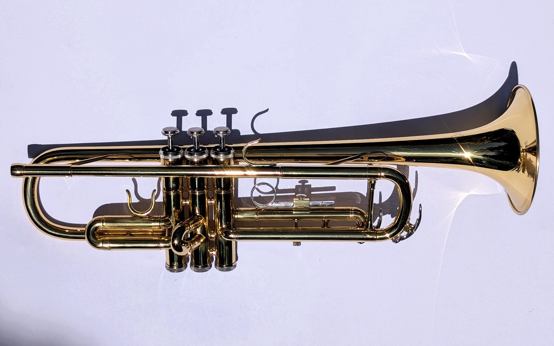 Bright brass student trumpet by PNW Music with classic brass finish and upgraded 7C mouthpiece for beginning musicians