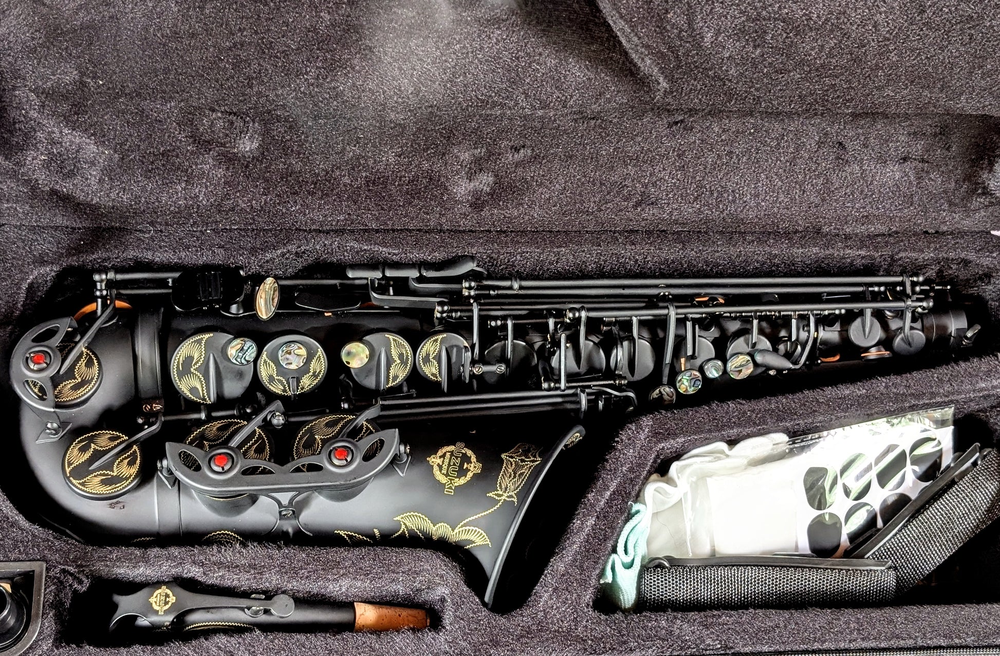 PNW Music matte black alto saxophone with Japanese-inspired finish, featuring high F# key and non-reflective surface for students