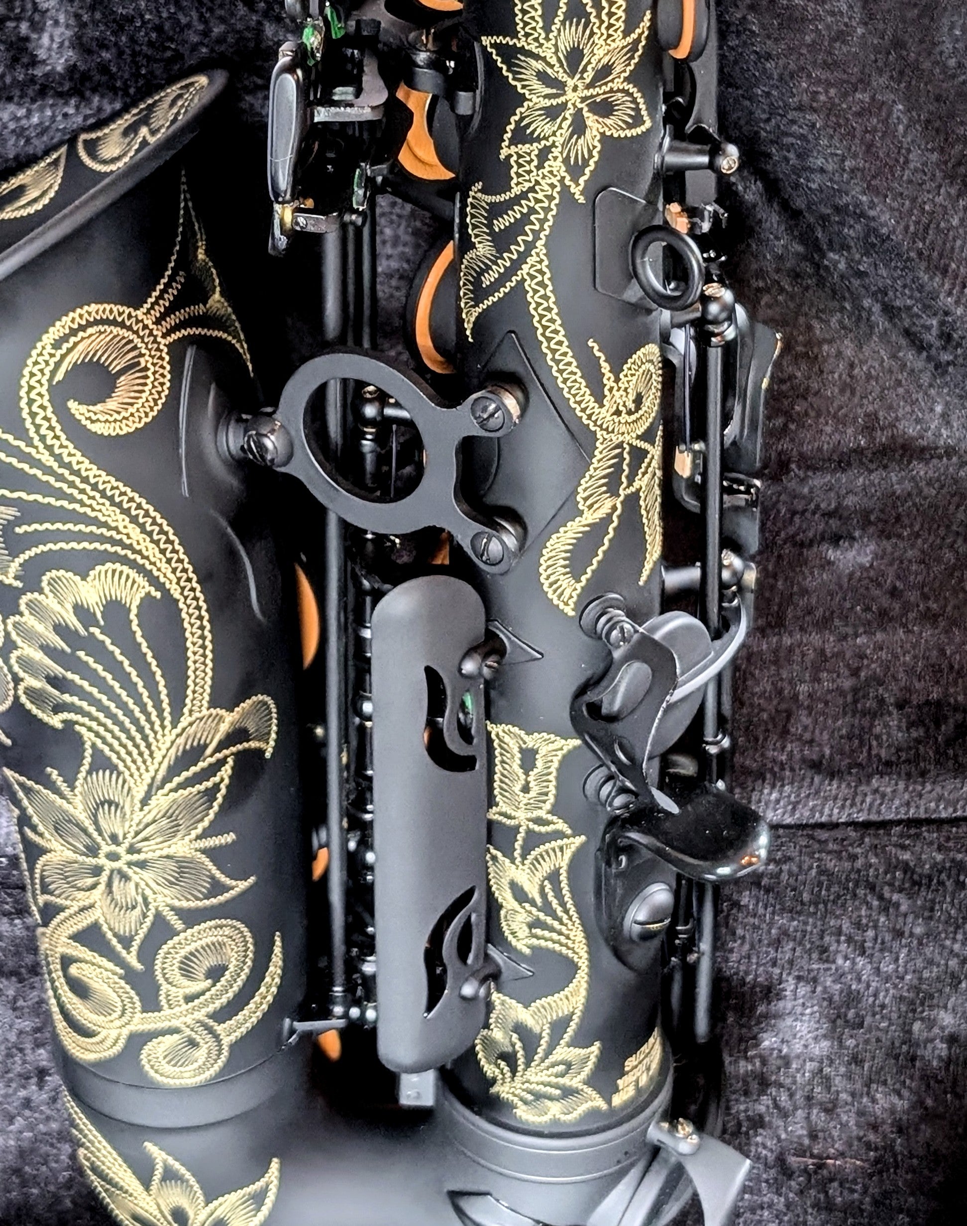 PNW Music matte black alto saxophone with Japanese-inspired finish, featuring high F# key and non-reflective surface for students