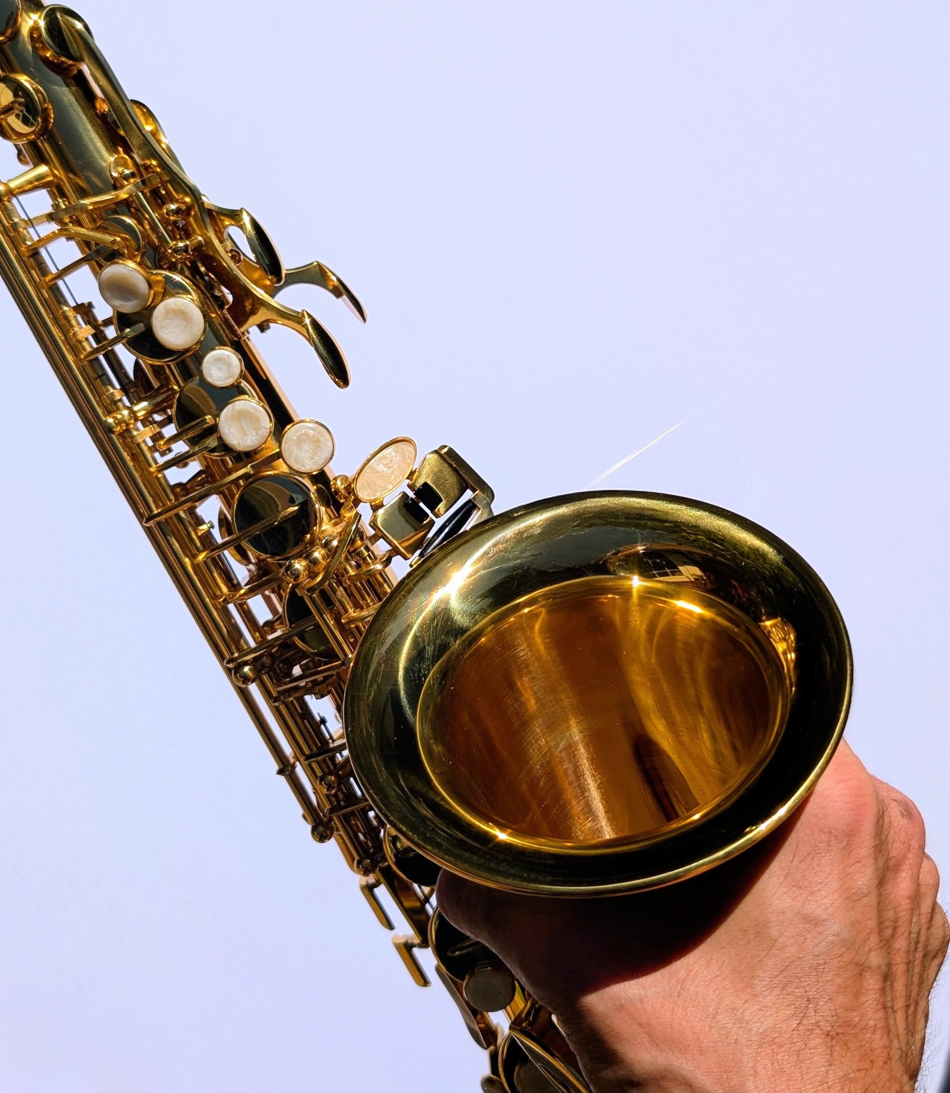 Bright brass finish alto saxophone by PNW Music featuring Premium high F# key for beginning and developing players
