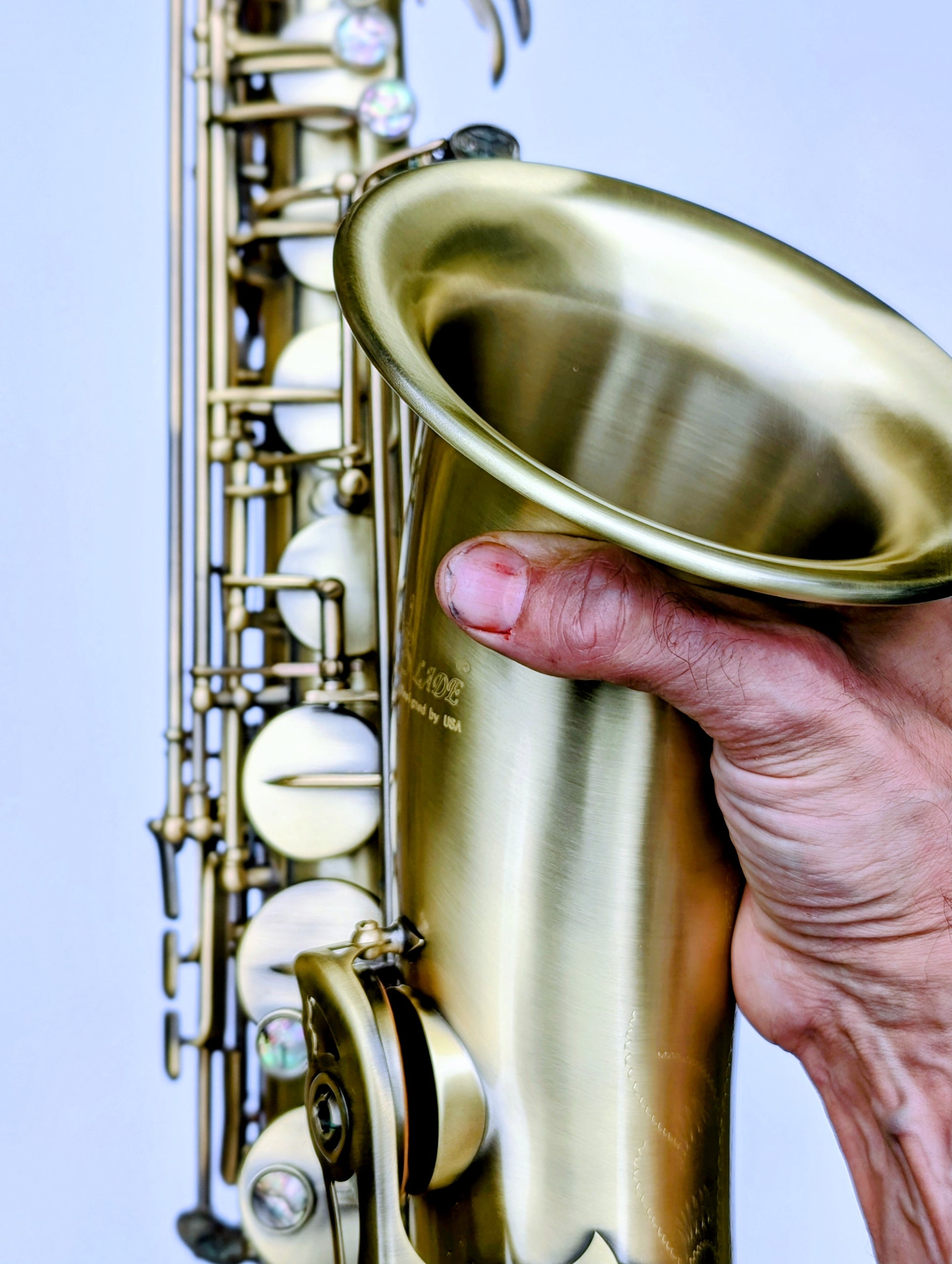 House matte brass tenor saxophone with responsive key action, reinforced posts, perfect for student and developing players