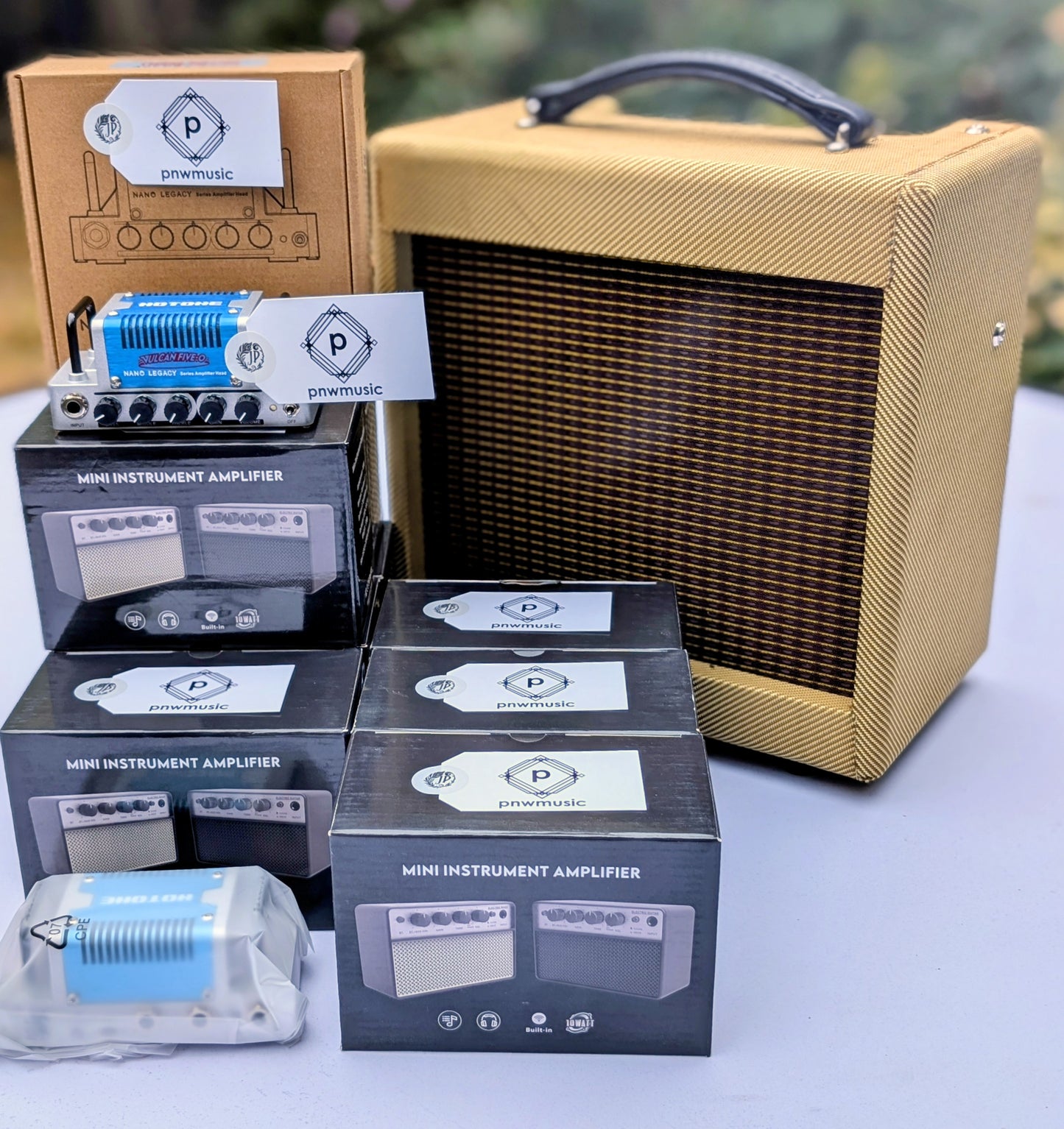 HOTONE Vulcan Hero Nano amp head with blue anodized faceplate, silver aluminum chassis, 5 control knobs for portable guitar amplification
