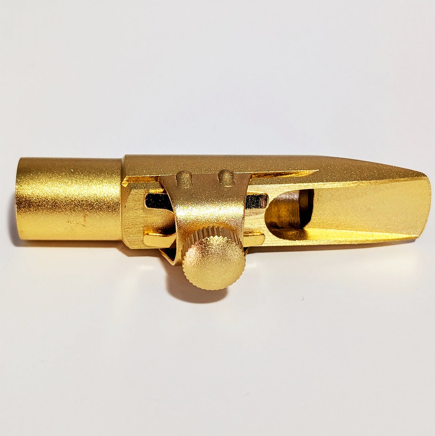 Matte gold finish alto saxophone mouthpiece with 7* tip opening, precision-machined brass construction, Premium grade design