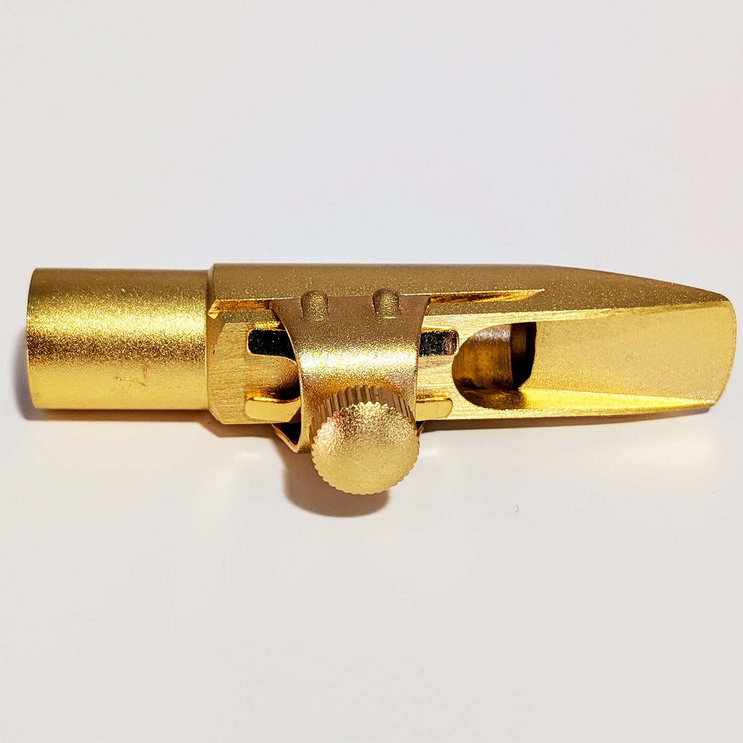 Matte gold finish alto saxophone mouthpiece with 7* tip opening, precision-machined brass construction, Premium grade design