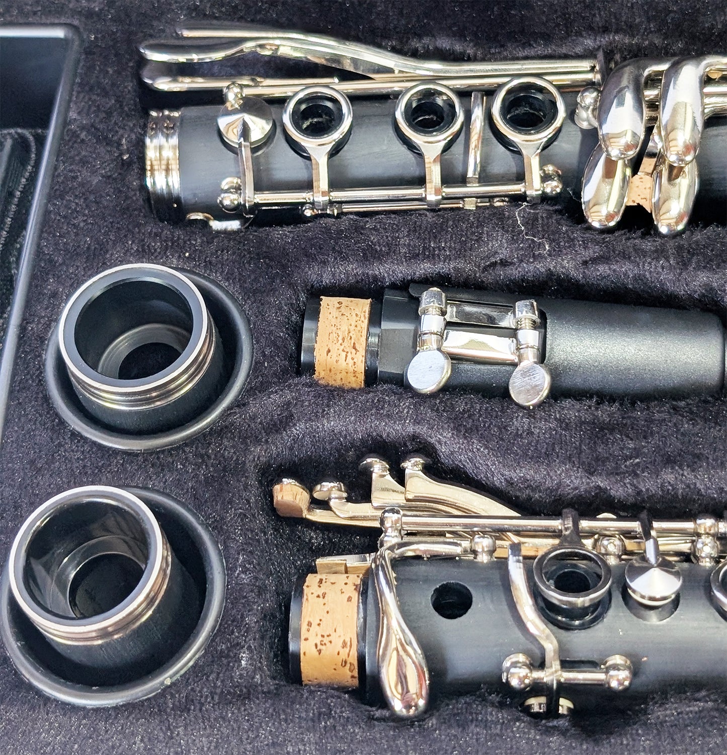 Slade brand student soprano clarinet with black Bakelite body, nickel-plated keys, and dual barrels for intonation flexibility