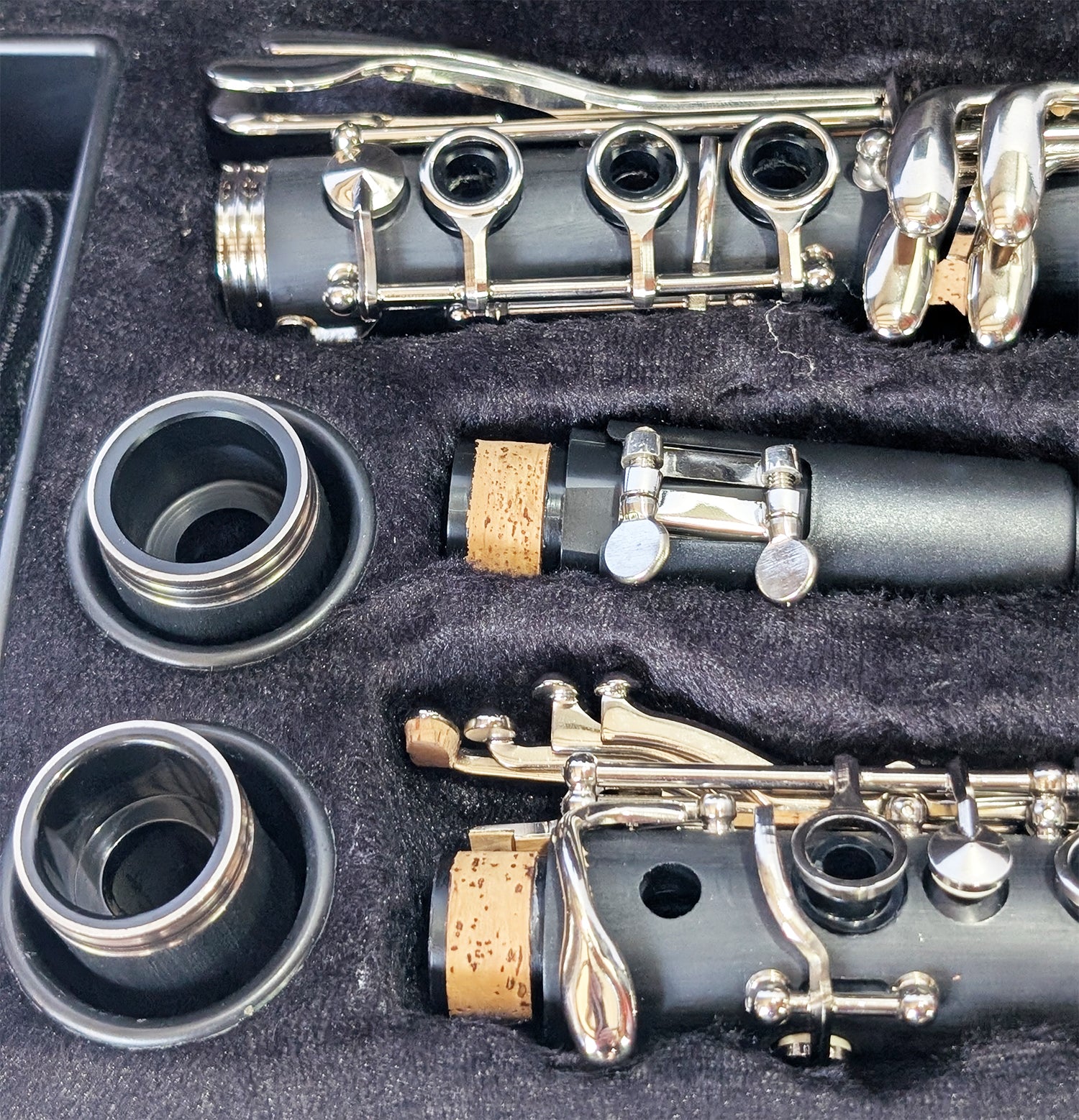 Slade brand student soprano clarinet with black Bakelite body, nickel-plated keys, and dual barrels for intonation flexibility