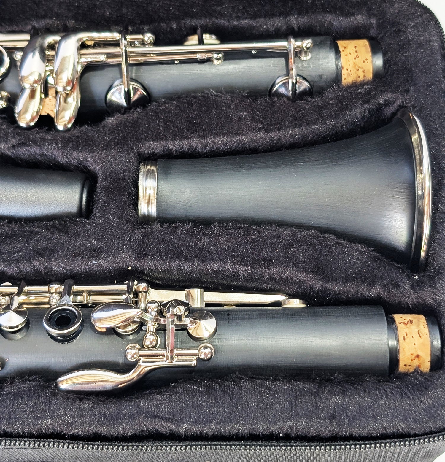 Slade brand student soprano clarinet with black Bakelite body, nickel-plated keys, and dual barrels for intonation flexibility