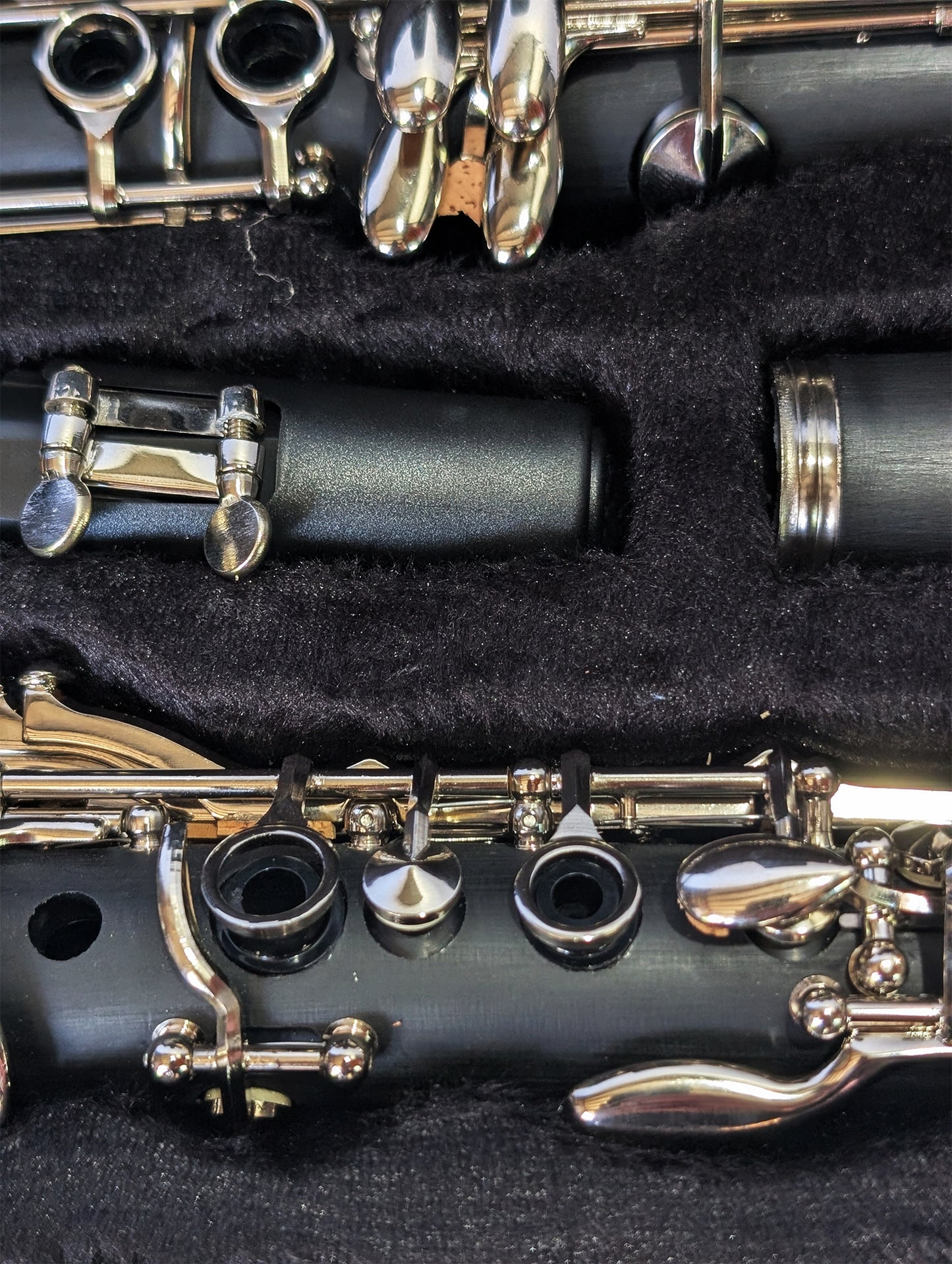 Slade brand student soprano clarinet with black Bakelite body, nickel-plated keys, and dual barrels for intonation flexibility