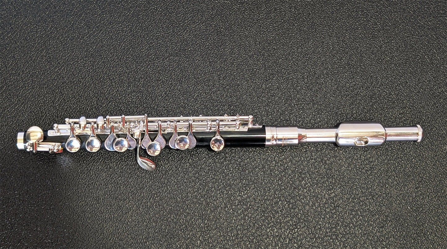 Slade silver-plated headjoint piccolo with black Bakelite body, silver-plated keys and mechanisms for student to intermediate players