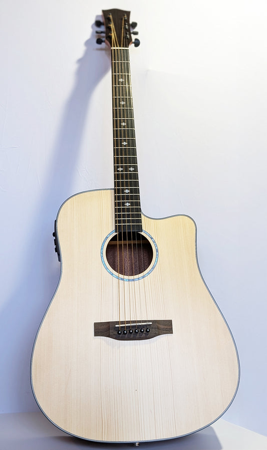 Cirin J. Pickett acoustic guitar with solid wood top, cutaway body design, mother of pearl inlays, and natural wood grain finish